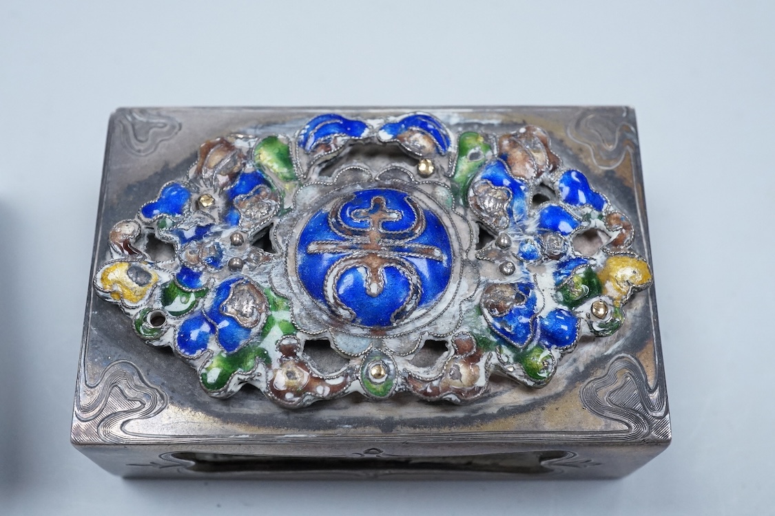 Two North American Edward I. Farmer of New York engraved sterling matchbox slides, one mounted with a jadeite carving, the other with polychrome enamelled surmount, both approximately 60mm.